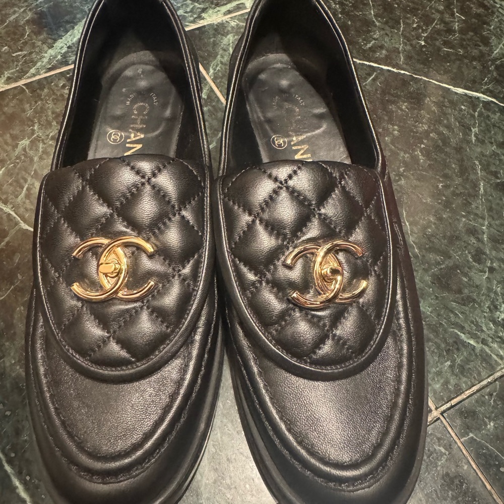 CHANEL Black and Gold Quilted Loafers